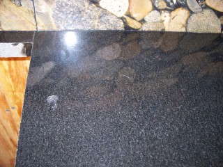 Scratches on Absolute Black granite.